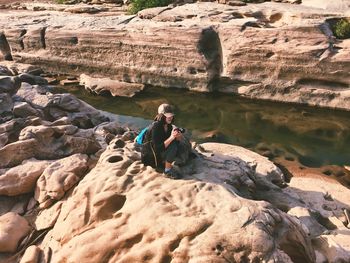 Man sitting on rock