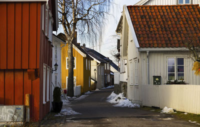 Houses against sky during winter