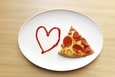 High angle view of heart shape in plate on table