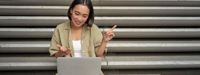 Young woman using mobile phone