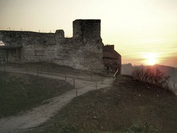 Built structure against sky during sunset