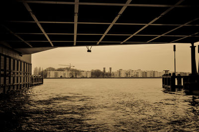 River in city against sky