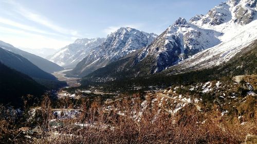 Scenic view of mountains against sky during winter