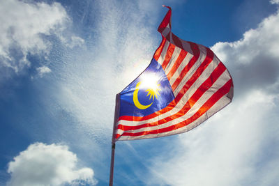 Low angle view of flag against sky