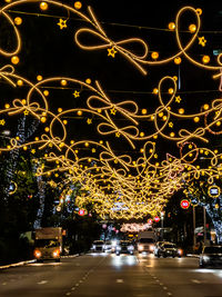 Illuminated light trails on street at night