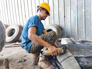 Side view of men working