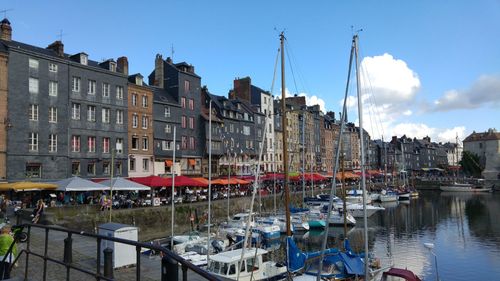 Boats in canal with buildings in background