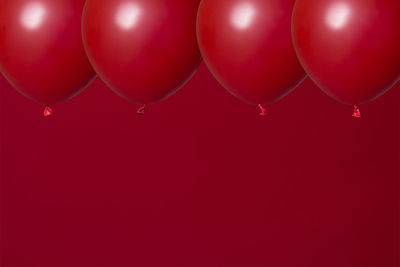 Low angle view of balloons against sky