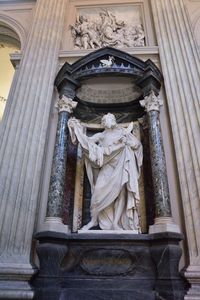 Low angle view of statue against building