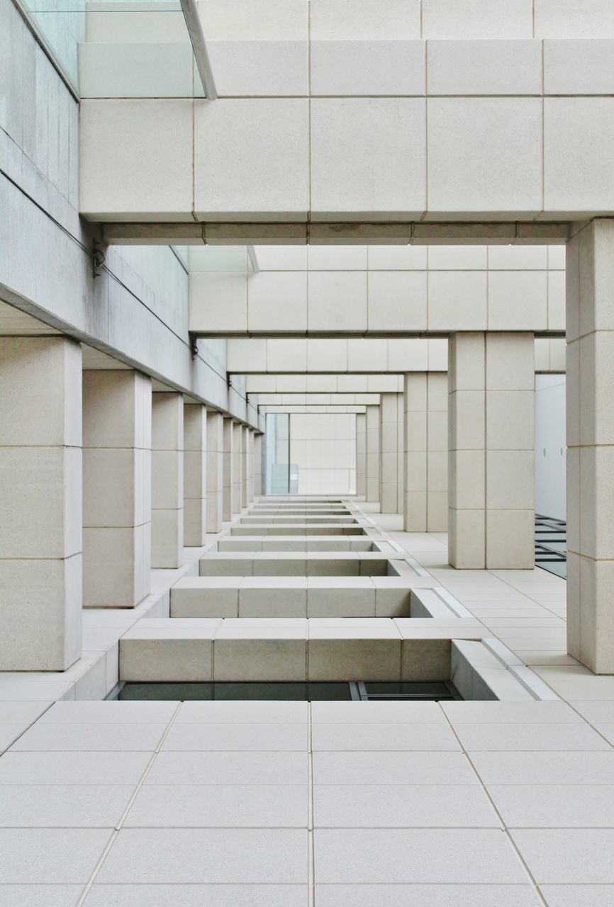 architecture, built structure, building exterior, building, the way forward, wall - building feature, tiled floor, modern, indoors, diminishing perspective, in a row, corridor, pattern, no people, day, empty, wall, flooring, steps, sunlight