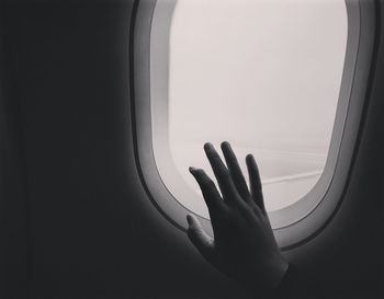 Person seen through airplane window