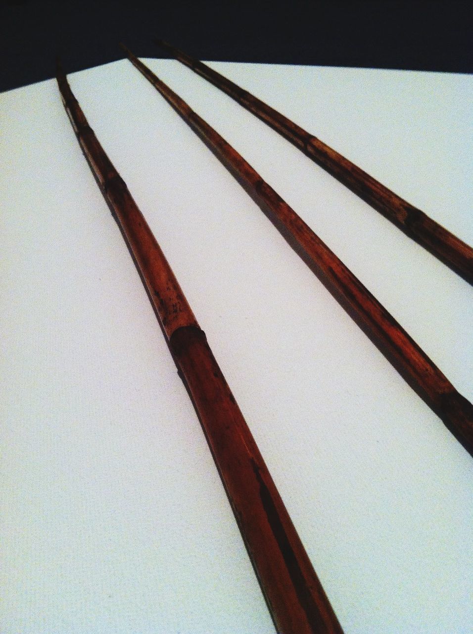 indoors, close-up, wood - material, still life, metal, wooden, no people, single object, wall - building feature, part of, simplicity, table, wood, high angle view, pattern, textured, brown, paper, shadow, copy space