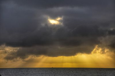 Scenic view of dramatic sky over sea