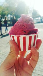 Close-up of woman holding ice cream cone