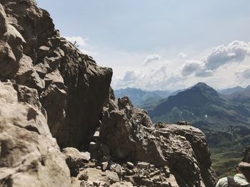 Rock formations on landscape against sky