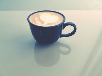 Close-up of cappuccino on table