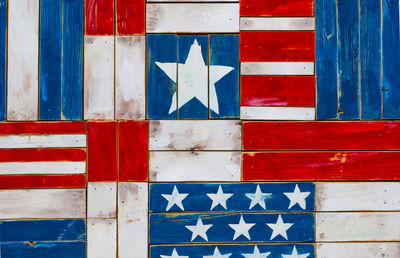 Full frame shot of wooden planks with american flag