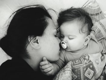 Close-up of mother and daughter at home