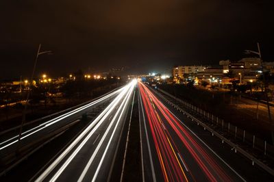 High angle view of light trails on road at night