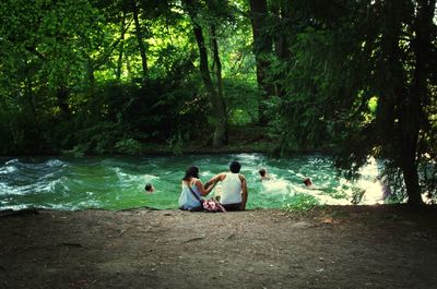 People relaxing in lake