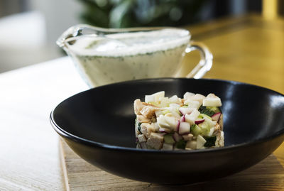 High angle view of okroshka ingredient on wooden table