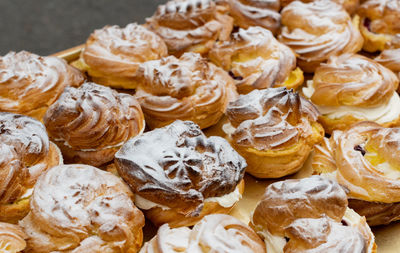 Cream puffs filled with cream and fruity cherries