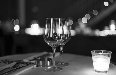 Close-up of wine glasses on table