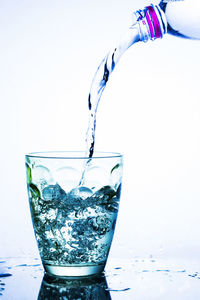 Close-up of drink drinking glass against white background