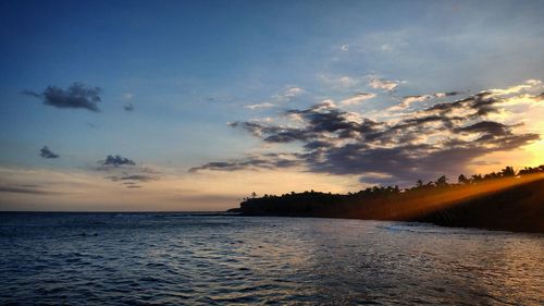 Scenic view of sea against sky at sunset