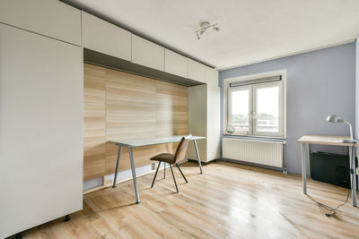 Empty chairs on hardwood floor