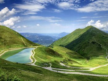 Scenic view of landscape and mountains against sky