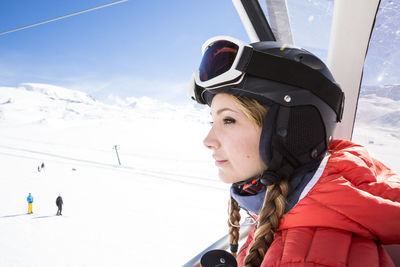 Young woman on ski lift