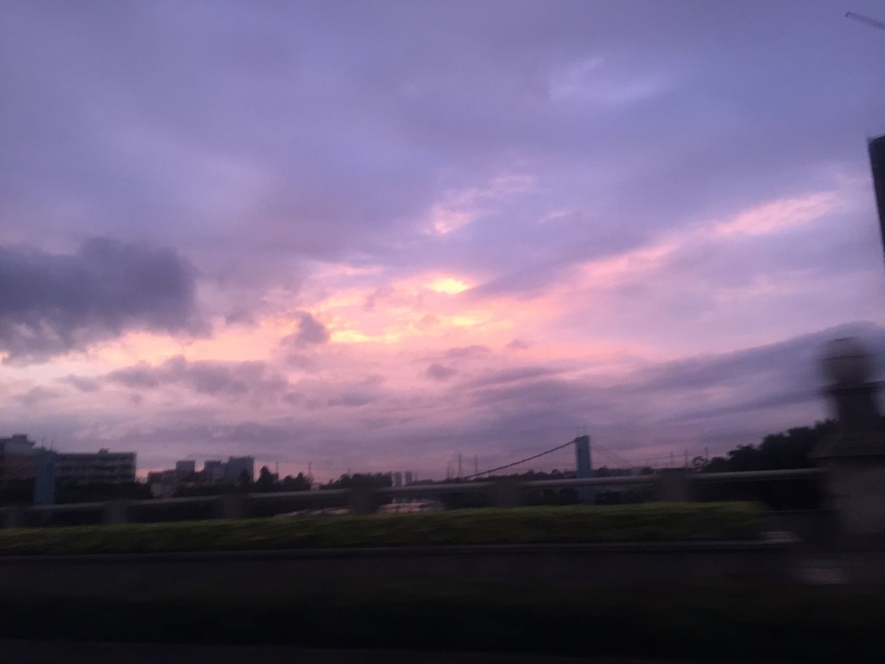 SILHOUETTE OF CITY AGAINST DRAMATIC SKY