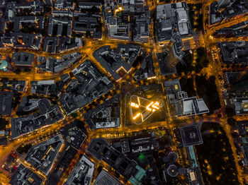 High angle birds eye top down overhead view of city lit up at night