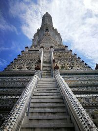 Low angle view of steps at temple against sky