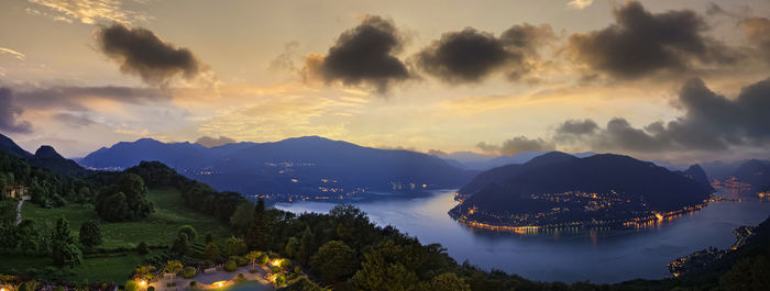 Scenic view of lake against sky during sunset