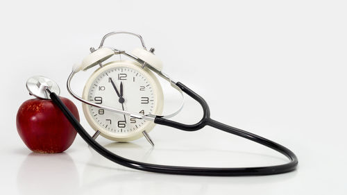 Close-up of clock against white background