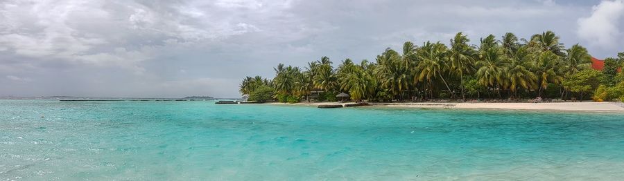 Scenic view of swimming pool against cloudy sky