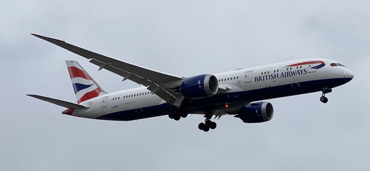 LOW ANGLE VIEW OF AIRPLANE AGAINST SKY