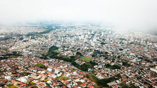 High angle view of townscape against sky in city