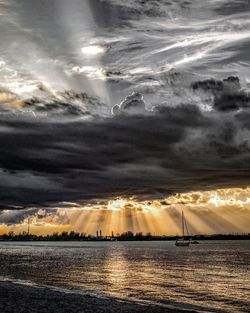 Scenic view of sea against storm clouds
