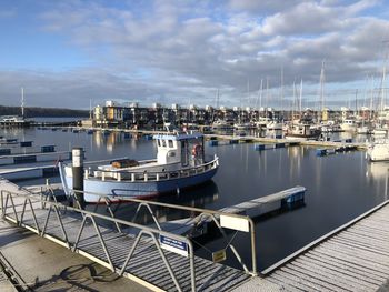 Boats moored at harbor