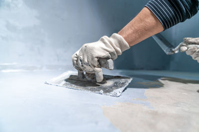 Cropped hand of person working on table