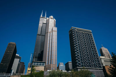 Low angle view of buildings against blue sky