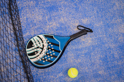 Close up padel or tennis racket and balls