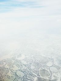 Aerial view of frozen lake against sky