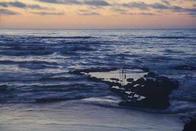 Scenic view of sea against sky during sunset