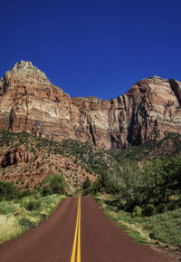 Long lonely road running trough the mountains