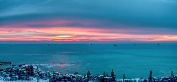 Scenic view of sea against sky at sunset