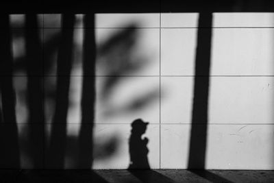 Shadow of people on tiled floor